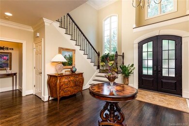Elegant entry with new iron door and light fixture