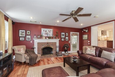 Step down into the cozy family room with the wood 