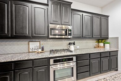 Kitchen offers lots of storage and counter space.