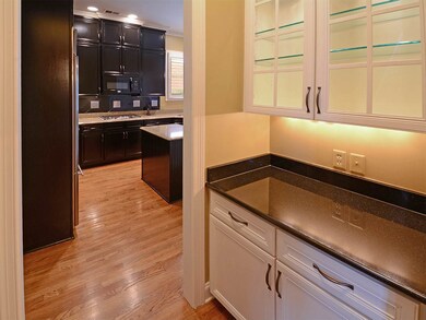 Leading from the dining room to the kitchen is the