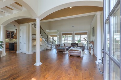 As you step inside, you notice the abundance of natural light and an open floor plan
