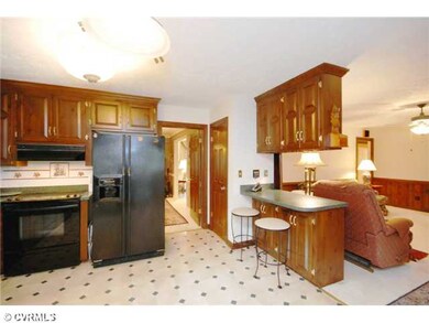 Kitchen - Kitchen opens to family room w/ brick fi