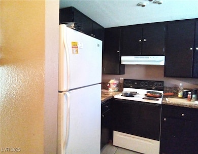 Kitchen featuring range with electric stovetop, ex