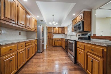 Kitchen with appliances with stainless steel finis