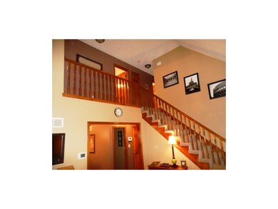 Stairwell and 2nd story open hallway.  All bedroom