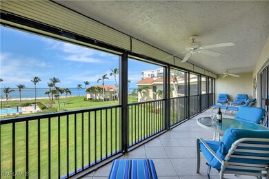 Sunroom with a water view and ceiling fan