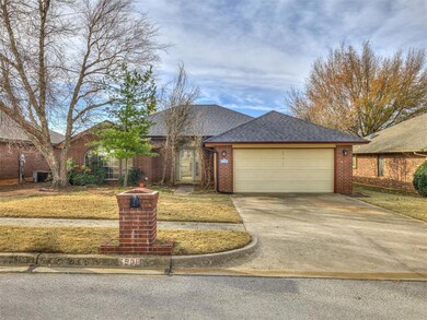Ranch-style home with cooling unit and a garage