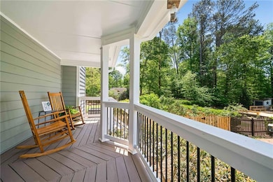 Wooden terrace featuring covered porch