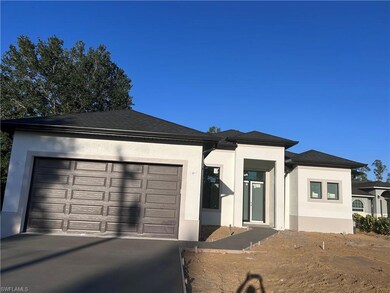 View of front of house featuring a garage, drivewa