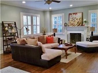 Spacious living room with original fireplace, plan