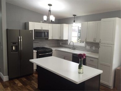 Newly remodeled kitchen with new appliances, floor