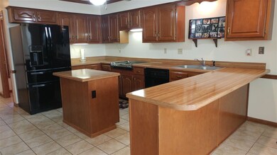 Large kitchen with loads of counter tops and cabin