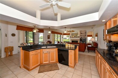 Kitchen looking towards family room,pool  & pond