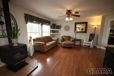 Laminate floors and woodstove in the living room