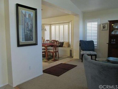 Looking toward dining room with window seat.