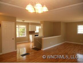 showing living,kitchen,stairs
