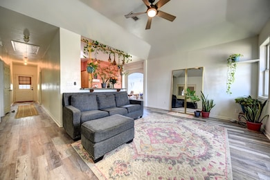 This inviting living room features wood-like floor