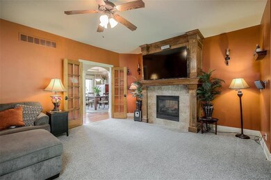 ATTRACTIVE FRENCH DOORS AND SEE-THROUGH FIREPLACE