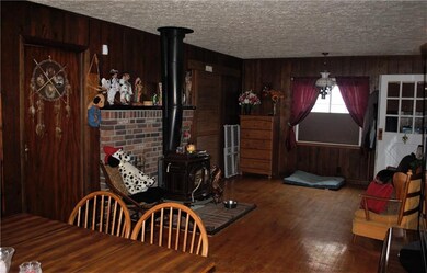 BONUS ROOM, FAMILY ROOM, DINING ROOM WITH WOOD BUR