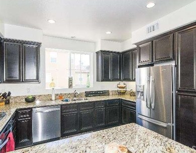 Stainless Steel Appliances and Espresso Cabinets i