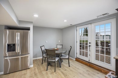 Dining space featuring light wood-type flooring and recessed lighting