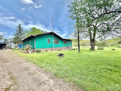 View of home's exterior with a yard