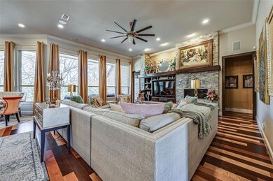 Living room looking into heavily treed backyard