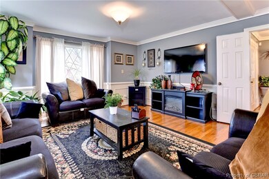 Living room with light hardwood / wood-style floor