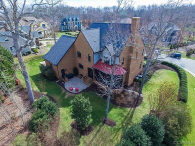 Rear Patio in Backyard is surrounded by Beautiful