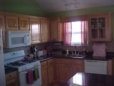 Kitchen also has vaulted ceiling and plenty of light.