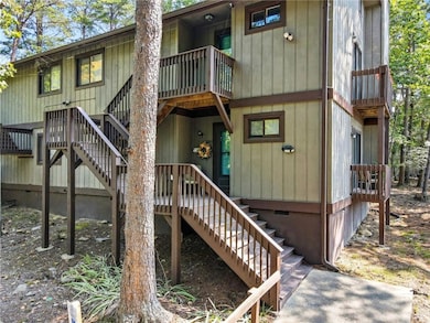 Entrance to property with a wooden deck and crawl space