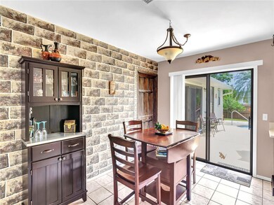 Dining area with sliders to patio & pool
