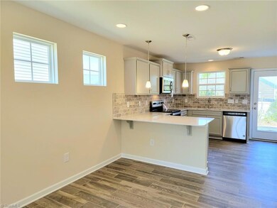 Ex: Dining open Kitchen **cabinets, counter, pendants and flooring different than photo**