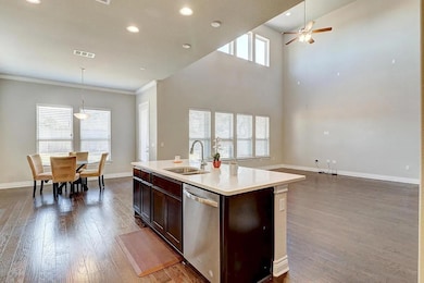 Kitchen featuring dishwasher, wood finished floor