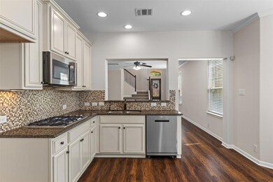 Kitchen featuring recessed lighting, dark wood-st
