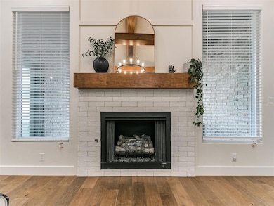 Details with dark hardwood / wood-style flooring and a notable chandelier