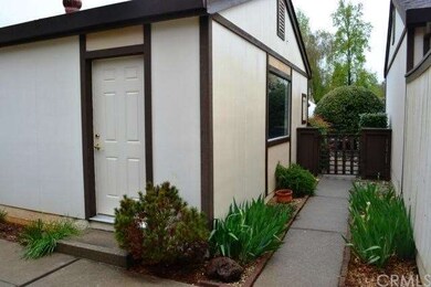 The quaint walkway from the driveway to the home i