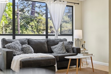 Living room featuring wood finished floors and baseboards