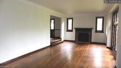 Spacious living room with wall of leaded glass win