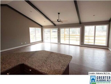 Great room with cathedral ceiling and exposed beam