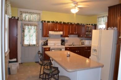 The kitchen has been updated to Cherry cabinetry a