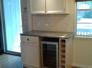 Bar Area with Wine Cooler and Stainless Steel Coun