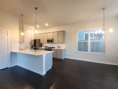 Kitchen featuring stainless steel appliances, dar