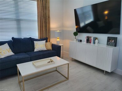 Living area featuring baseboards