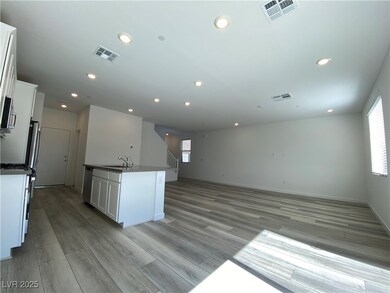 Kitchen featuring white cabinetry, recessed lighti