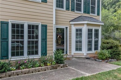 Lush landscaping all around provides a lovely intr