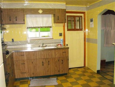 Kitchen. Walk out to the Sun porch & level back ya