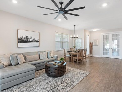 Living area with baseboards, recessed lighting, wo