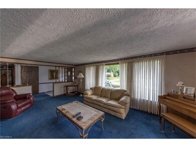 Living room with large picture windows.