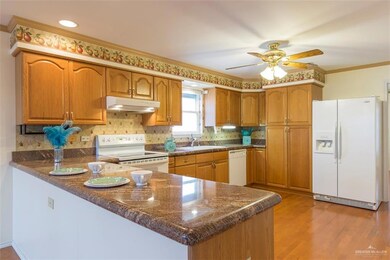 The kitchen area has bar seating and lots of space for preparing and staying organized!  All appliances go with this home.  The pantry area is custom with roll out drawers that are wide and deep.  The drawers under the counter top are double wide and separated for additional storage and organization. This home has lots of space and every room has a great deal of storage.